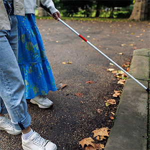 Person walking with a cane