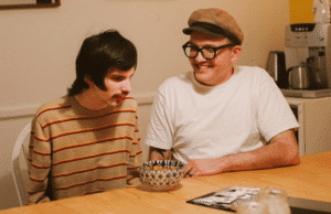 Young man being supported in his home