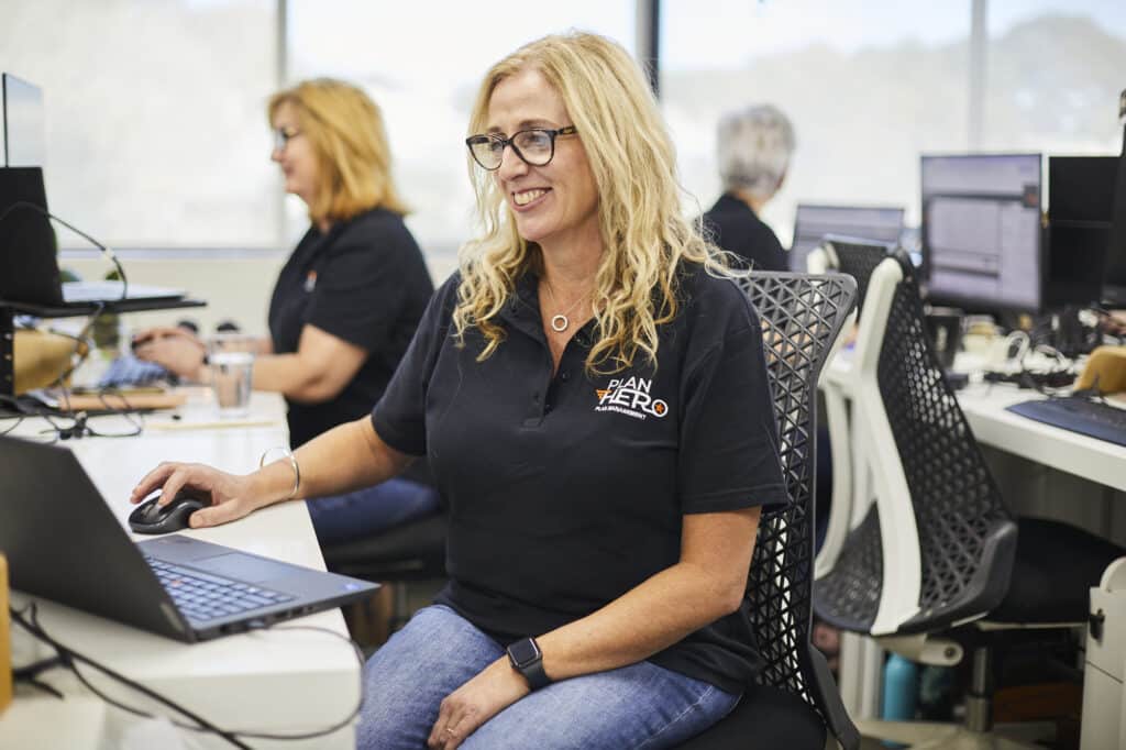 ndis plan hero plan manager in queensland on her desk
