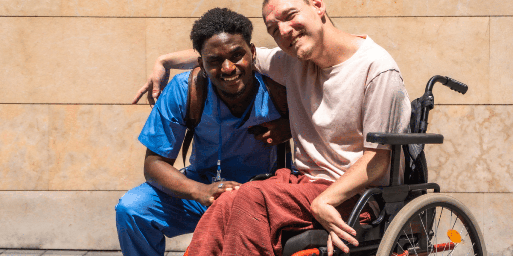a person in wheelchair with carer
