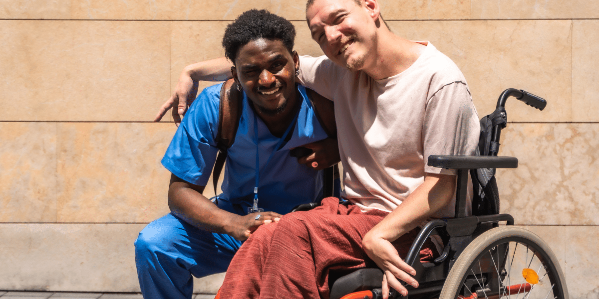 a person in wheelchair with carer