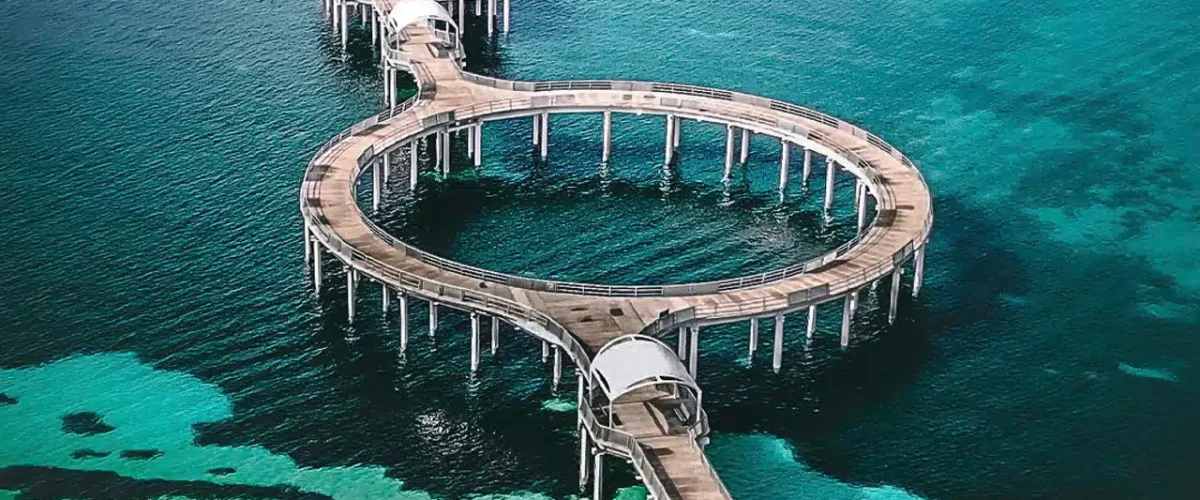 Aerial view of the circular jetty extending into clear blue water in Whyalla, South Australia.